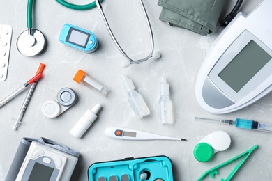Flat lay composition with medical objects on grey background
