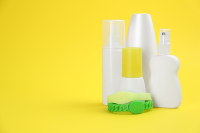 Photo of Set of different insect repellents on yellow background. Space for text