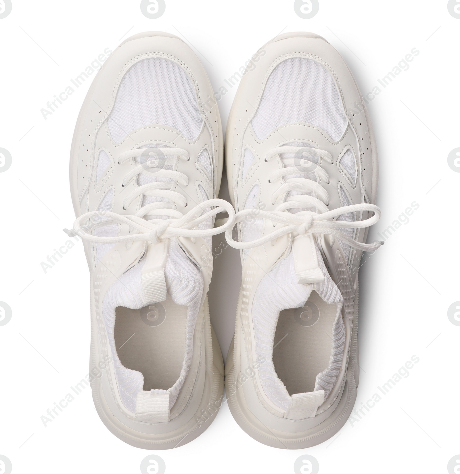 Photo of Pair of stylish sneakers isolated on white, top view