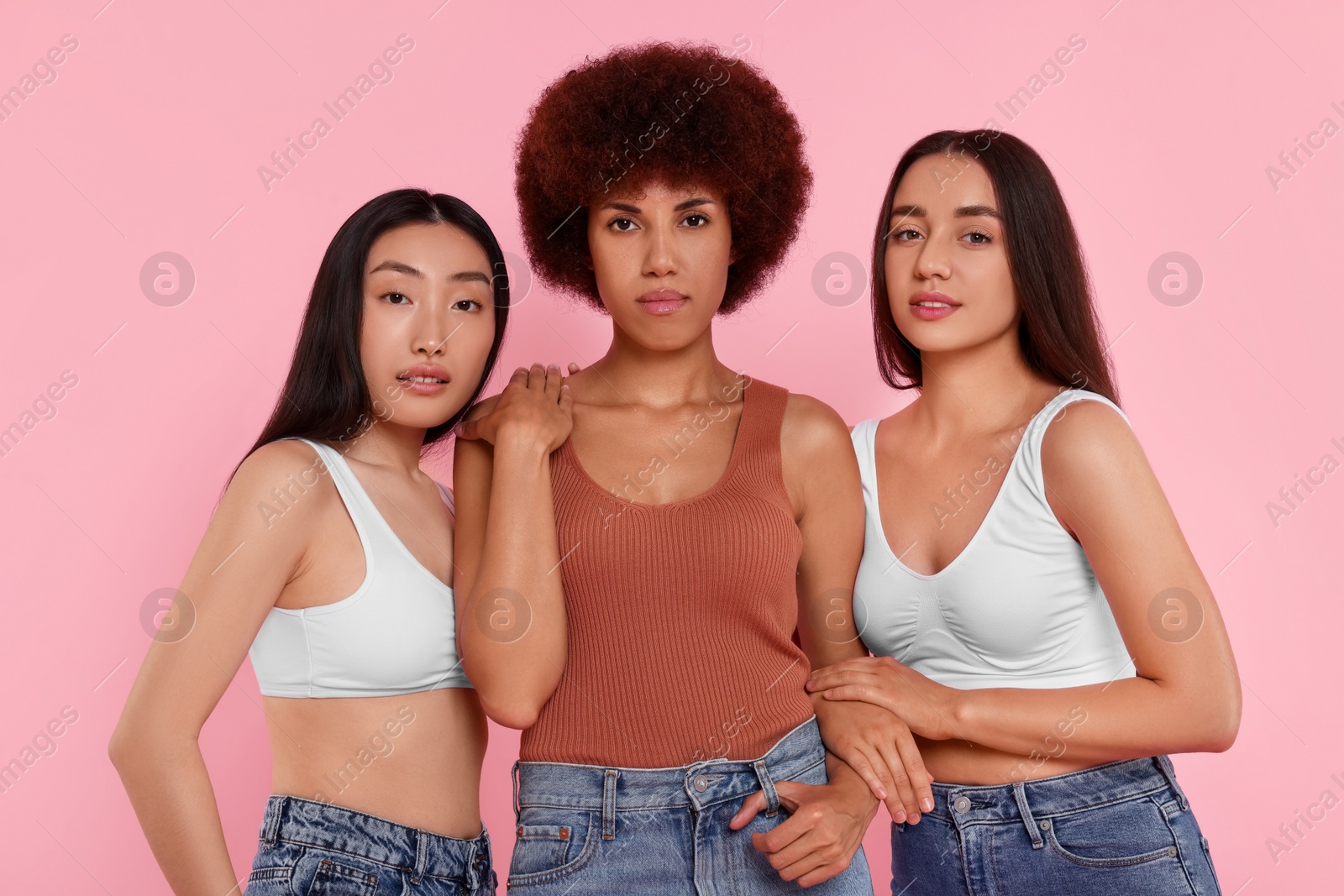 Photo of Portrait of beautiful young women on pink background