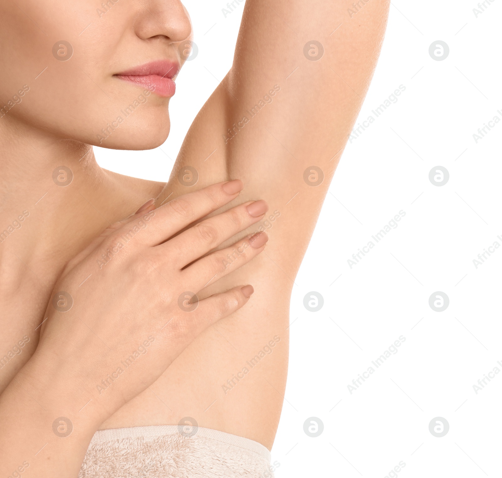 Photo of Young woman showing armpit with smooth clean skin on white background, closeup