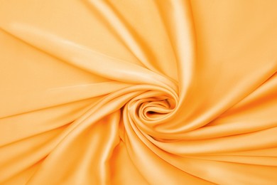 Image of Texture of delicate orange silk as background, top view