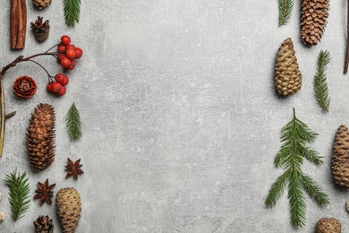 Photo of Flat lay composition with pinecones on light grey background, space for text