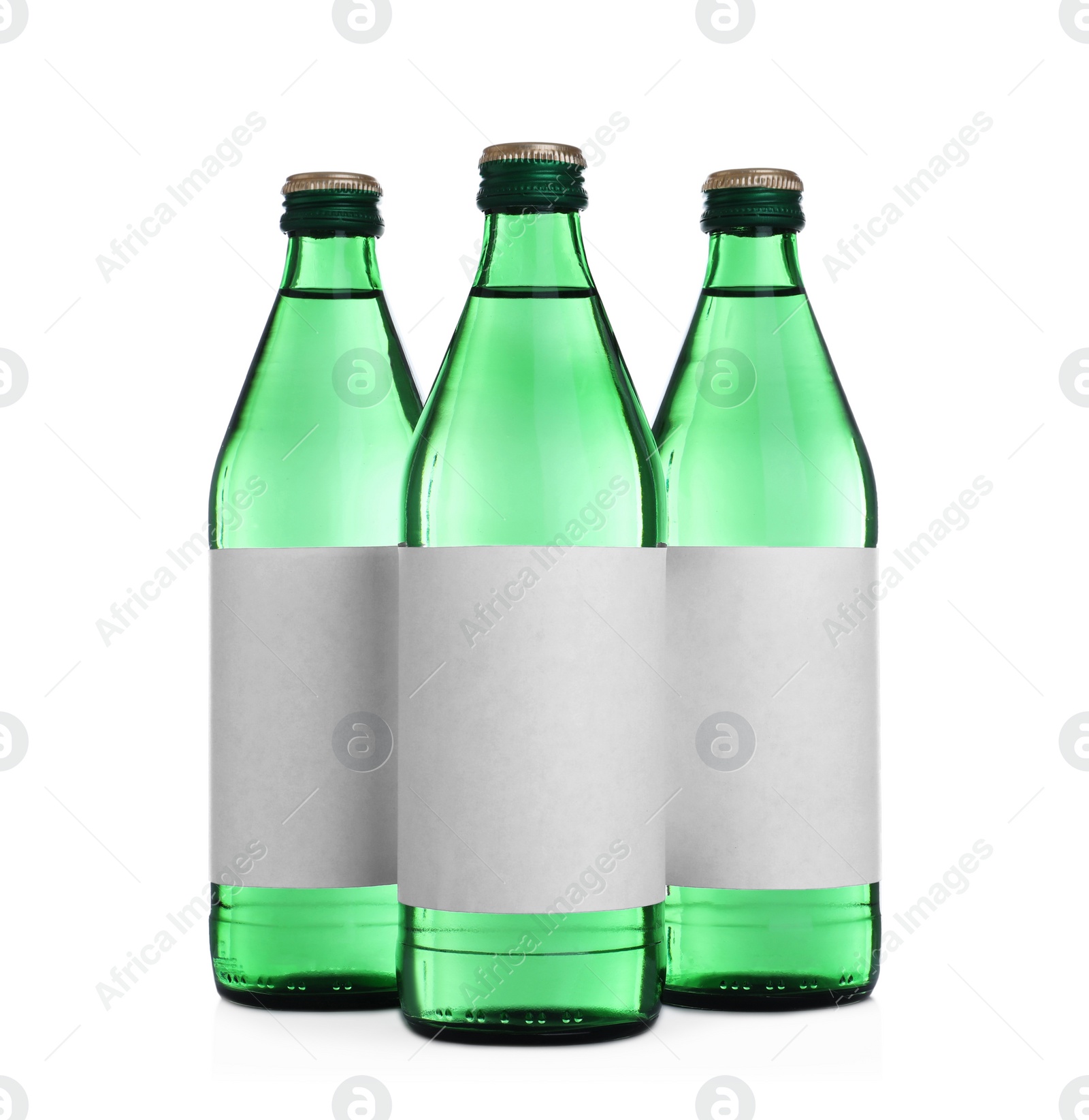 Photo of Glass bottles with soda water on white background