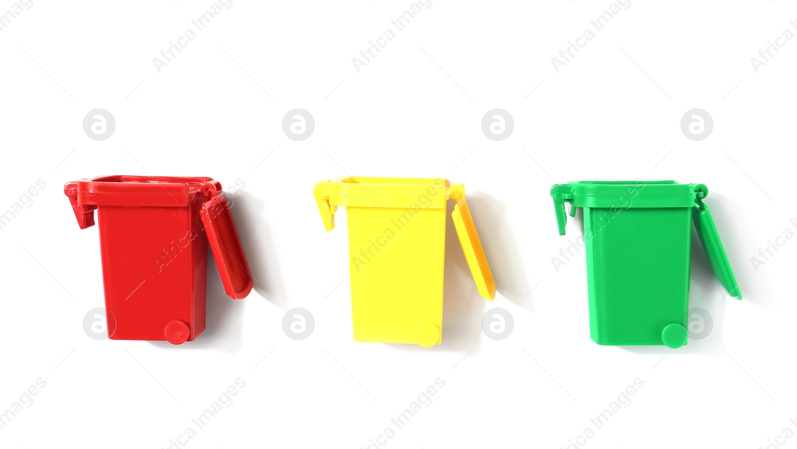 Photo of Trash bins isolated on white, top view. Waste recycling concept