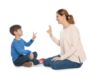 Hearing impaired mother and her child talking with help of sign language on white background