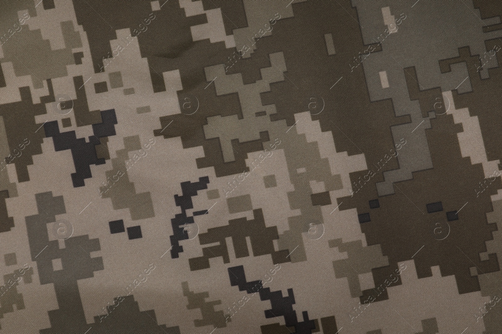 Photo of Texture of camouflage fabric as background, top view