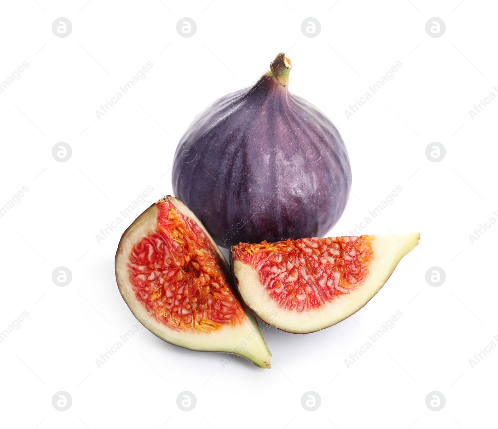 Photo of Whole and cut purple figs on white background