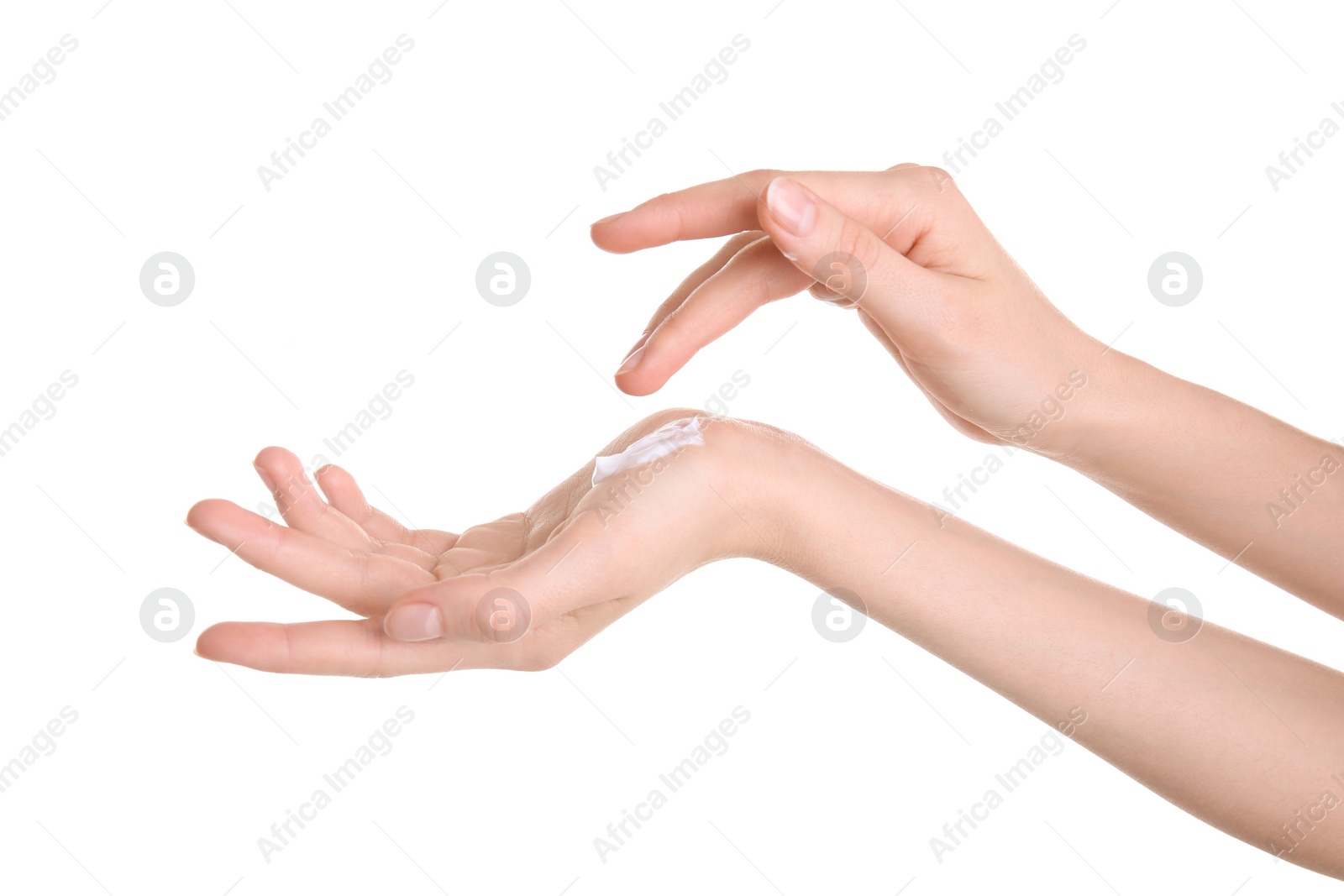 Photo of Young woman applying hand cream against on white background