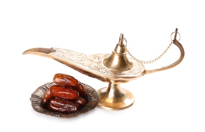 Photo of Aladdin lamp and dates, isolated on white