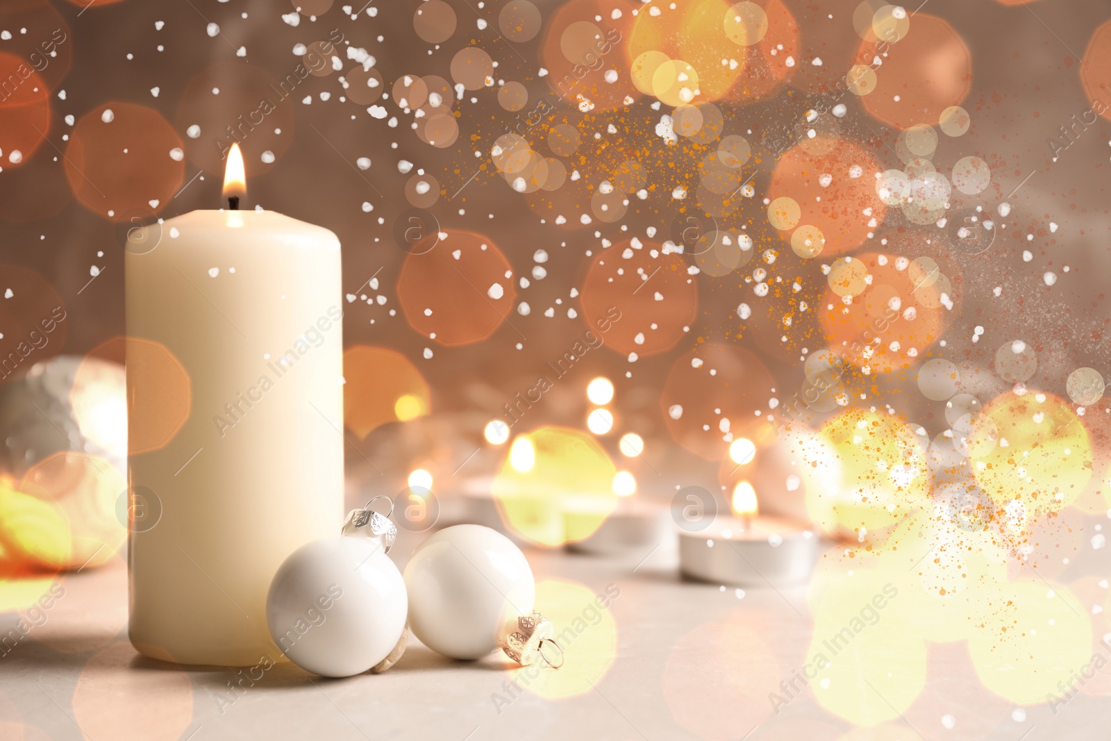 Image of Burning candles and Christmas decoration on table, bokeh effect