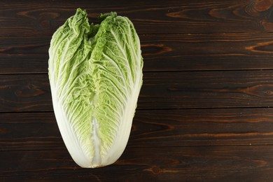 Photo of Fresh ripe Chinese cabbage on wooden table, top view. Space for text