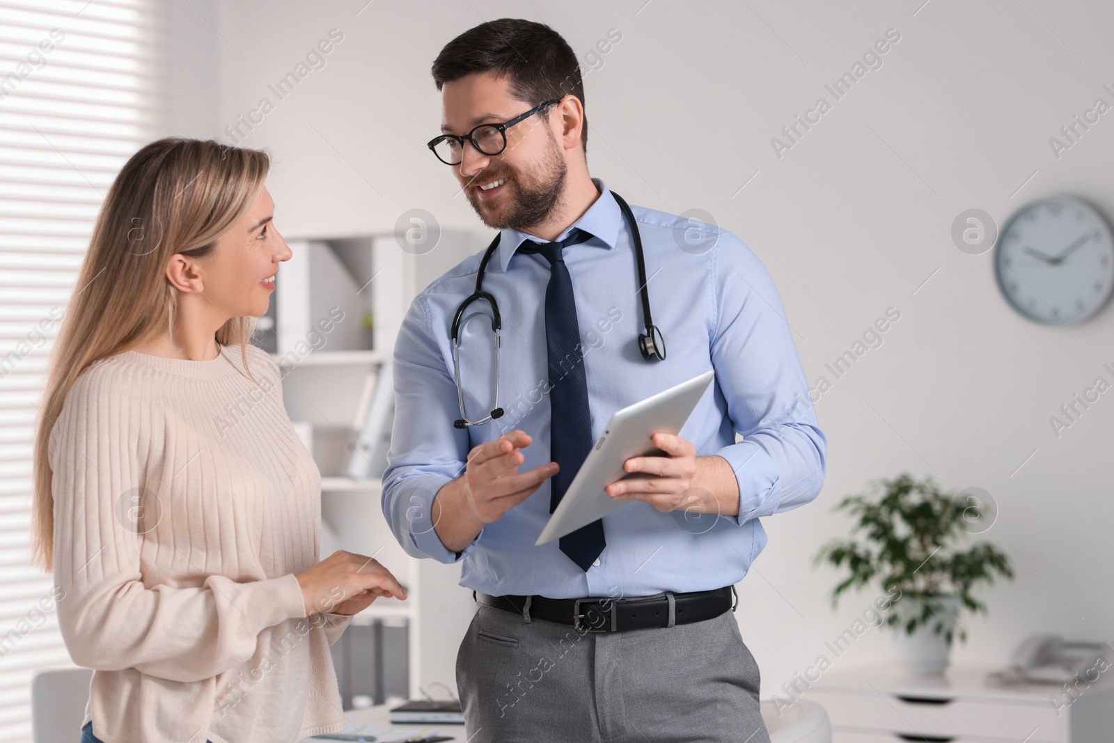 Photo of Professional doctor working with patient in hospital