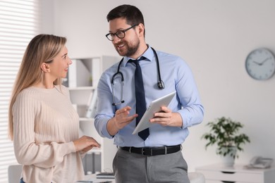 Photo of Professional doctor working with patient in hospital