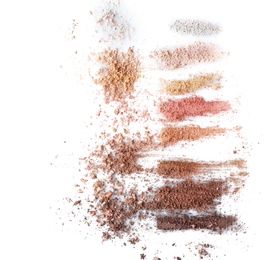 Photo of Crushed eye shadows on white background. Professional makeup products