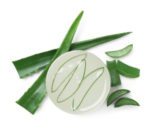 Photo of Tasty aloe juice in glass and cut leaves isolated on white, top view