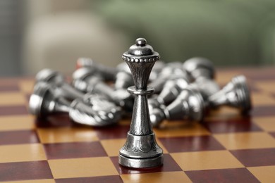 Silver bishop on chess board, closeup view