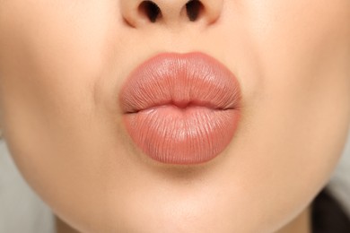 Photo of Closeup view of woman with nude lipstick
