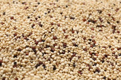Photo of Raw quinoa seeds as background, closeup view
