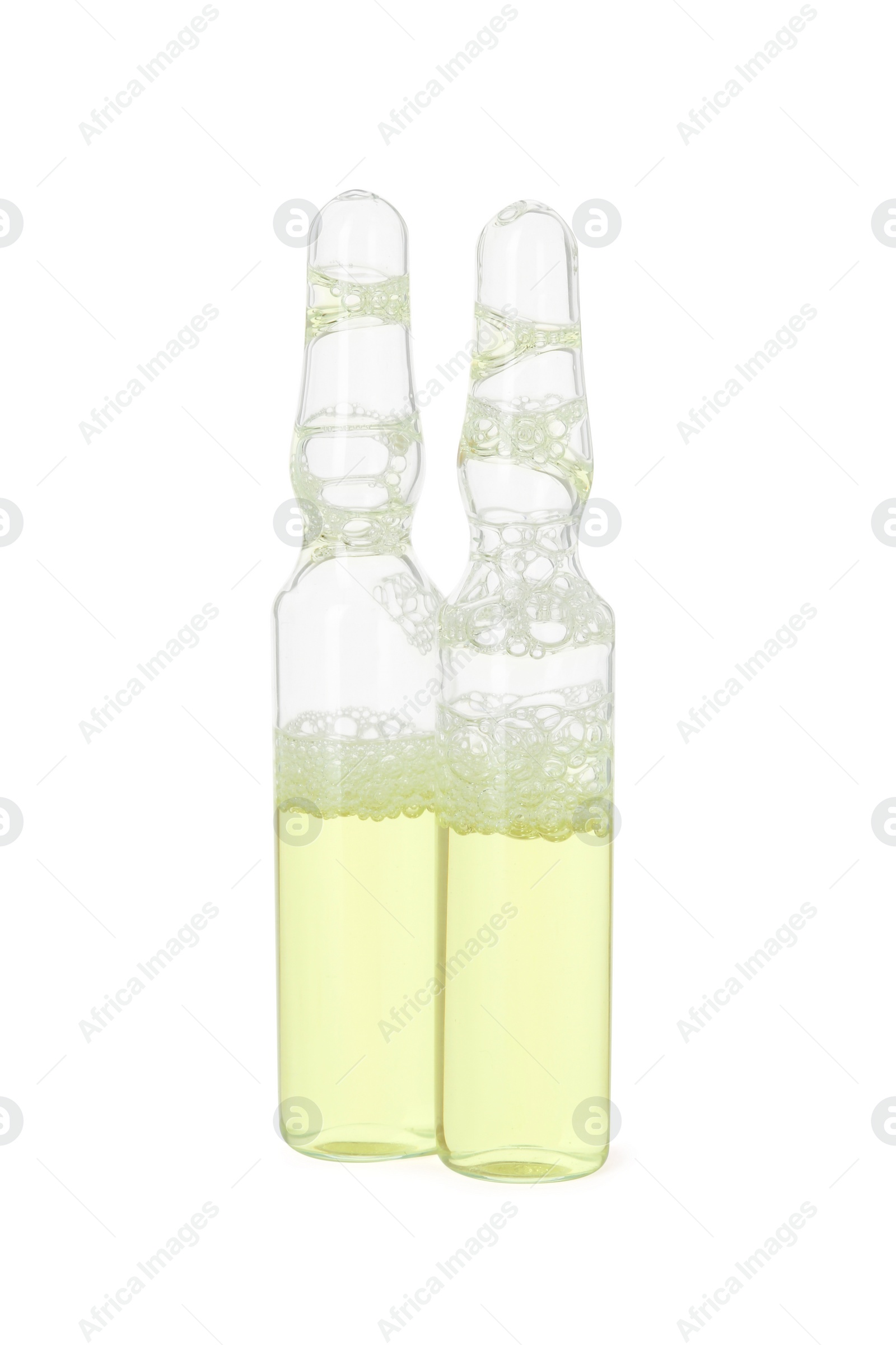 Photo of Glass ampoules with liquid isolated on white