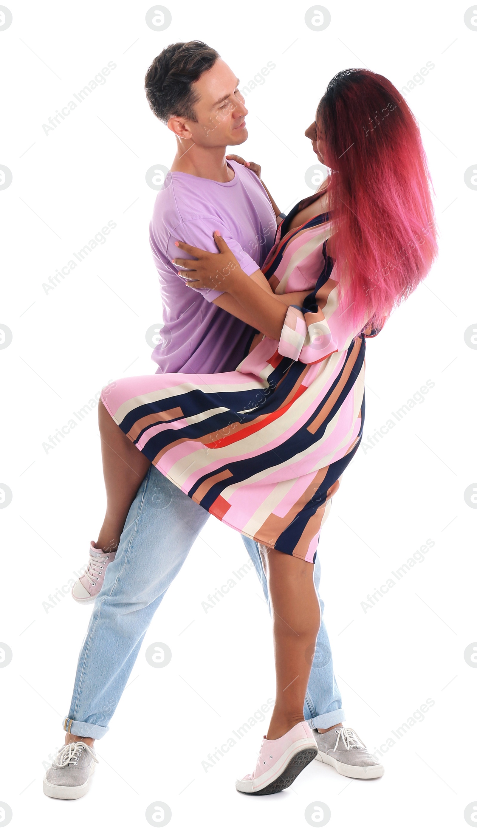 Photo of Beautiful lovely couple dancing on white background