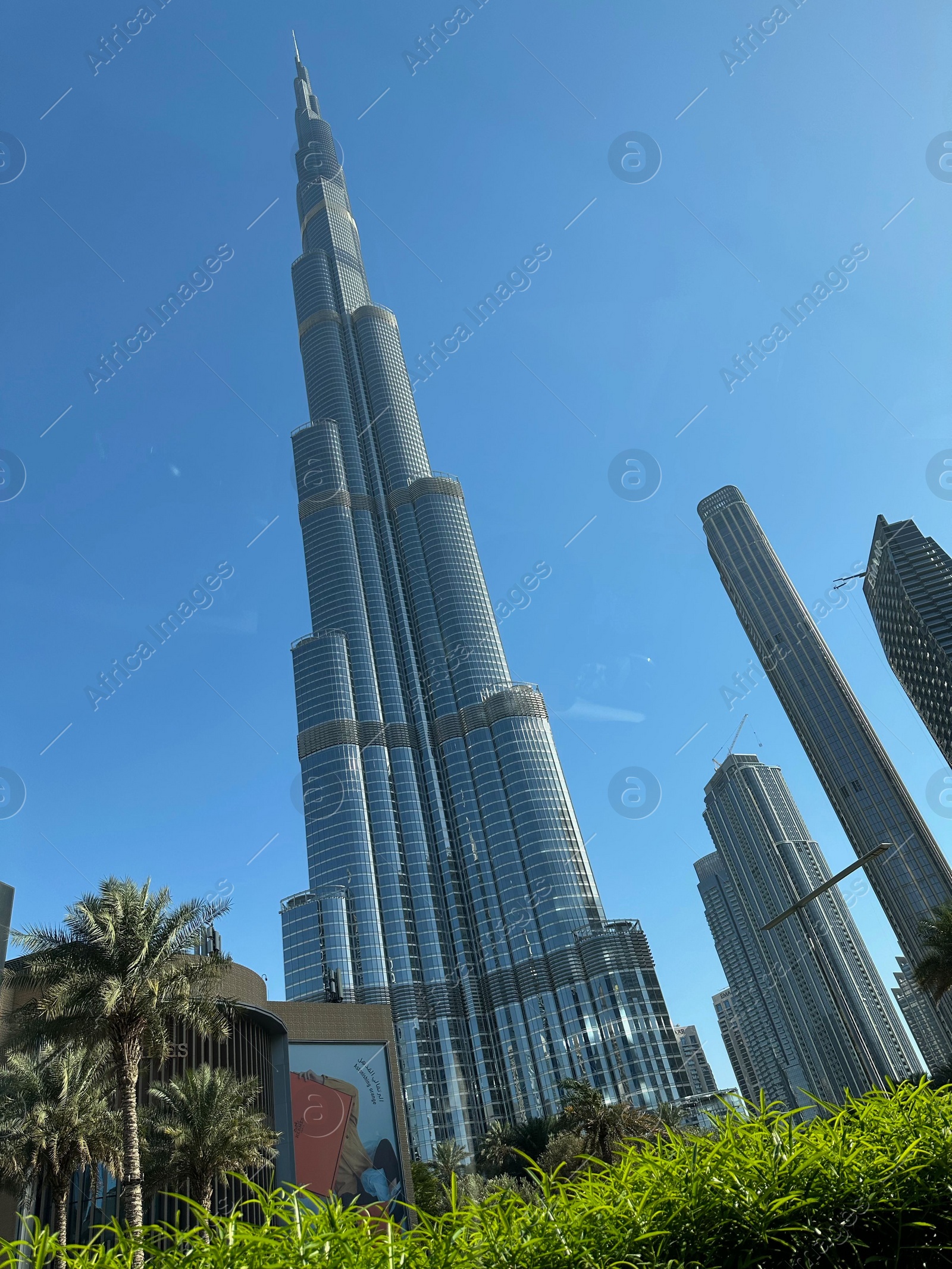 Photo of Dubai, United Arab Emirates - May 2, 2023: Beautiful view of Burj Khalifa in city under blue sky