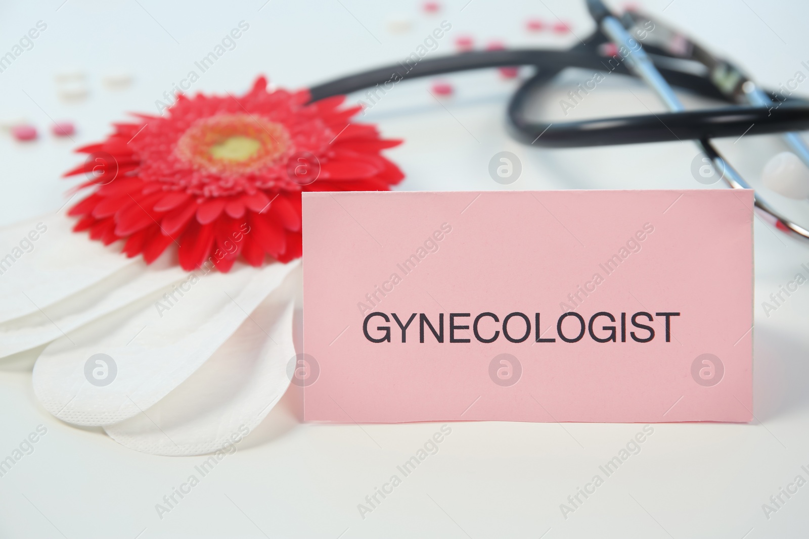 Photo of Composition with menstrual pads and flower on color background. Gynecological checkup