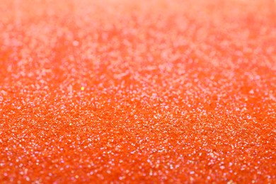 Photo of Shiny orange glitter as background. Bokeh effect