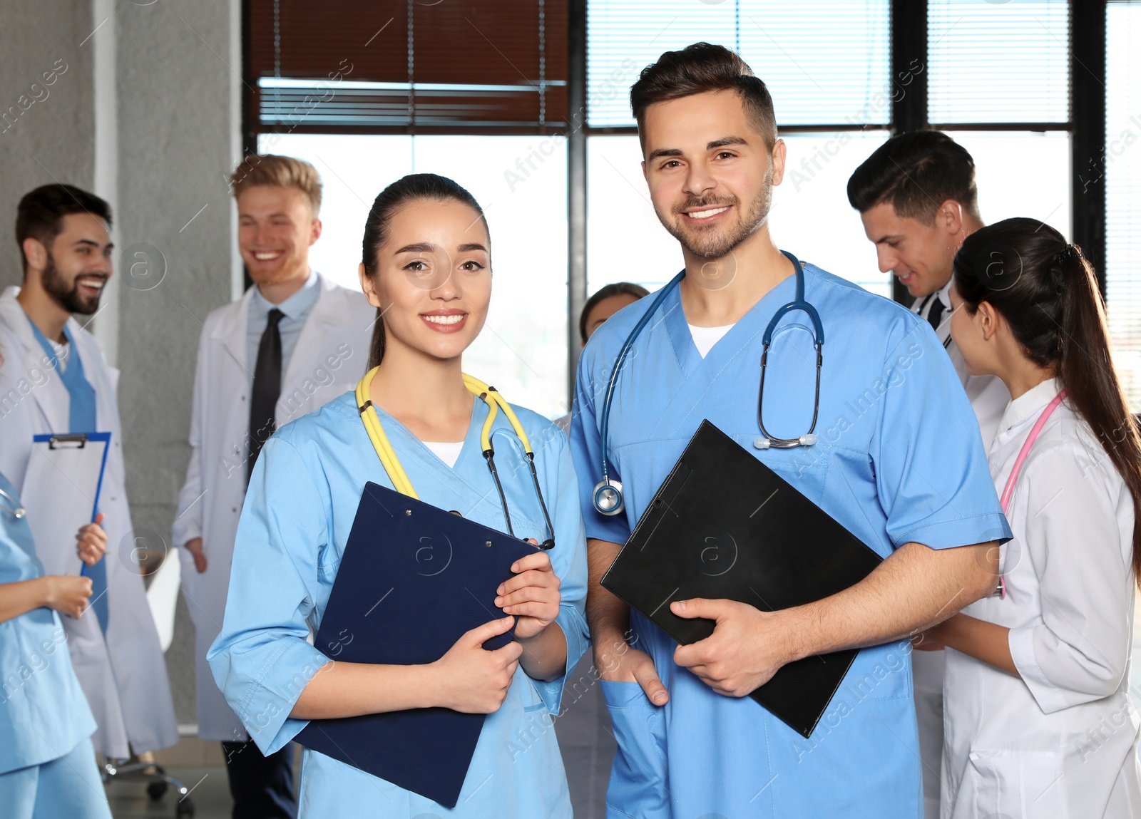 Photo of Portrait of medical workers indoors. Unity concept