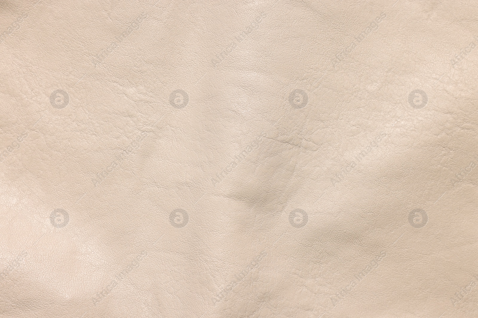 Photo of Beige natural leather as background, top view