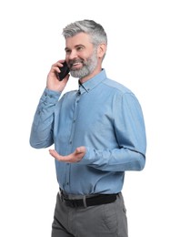 Mature businessman in stylish clothes talking on smartphone against white background