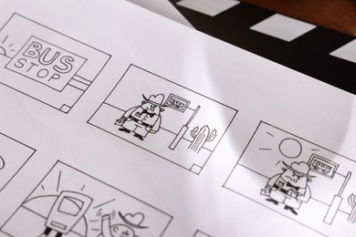 Photo of Storyboard with cartoon sketches at workplace, closeup. Pre-production process