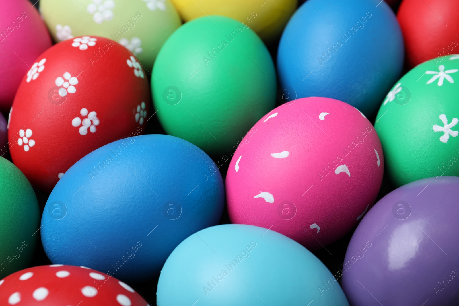 Photo of Colorful eggs as background, closeup. Happy Easter