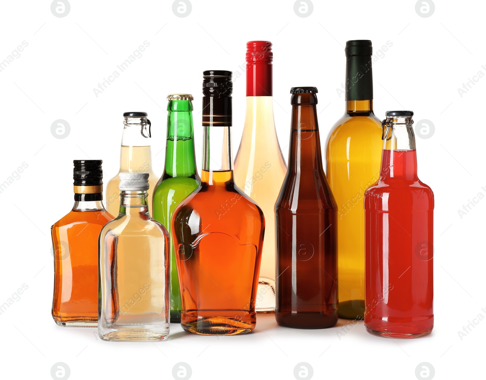 Photo of Bottles with different alcoholic drinks on white background