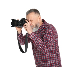 Mature male photographer with camera on white background