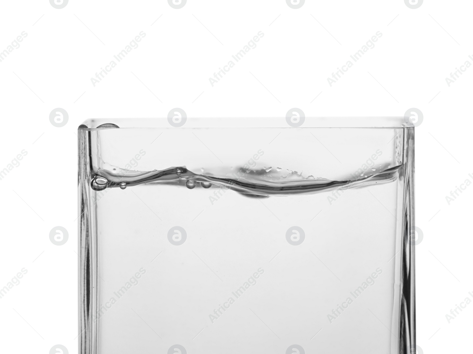 Photo of Glass of cold refreshing water on white background