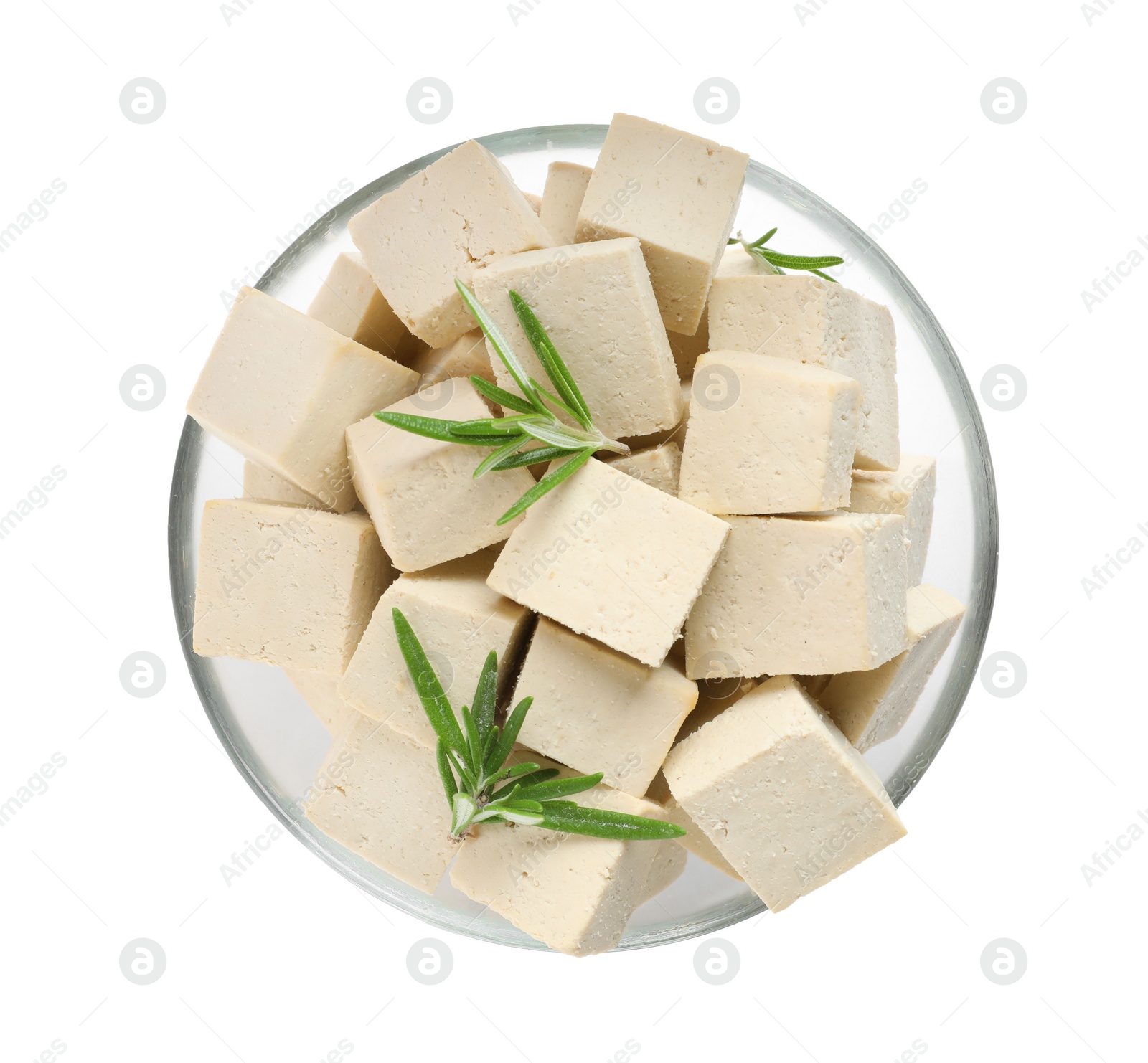 Photo of Glass bowl with delicious tofu and rosemary isolated on white, top view