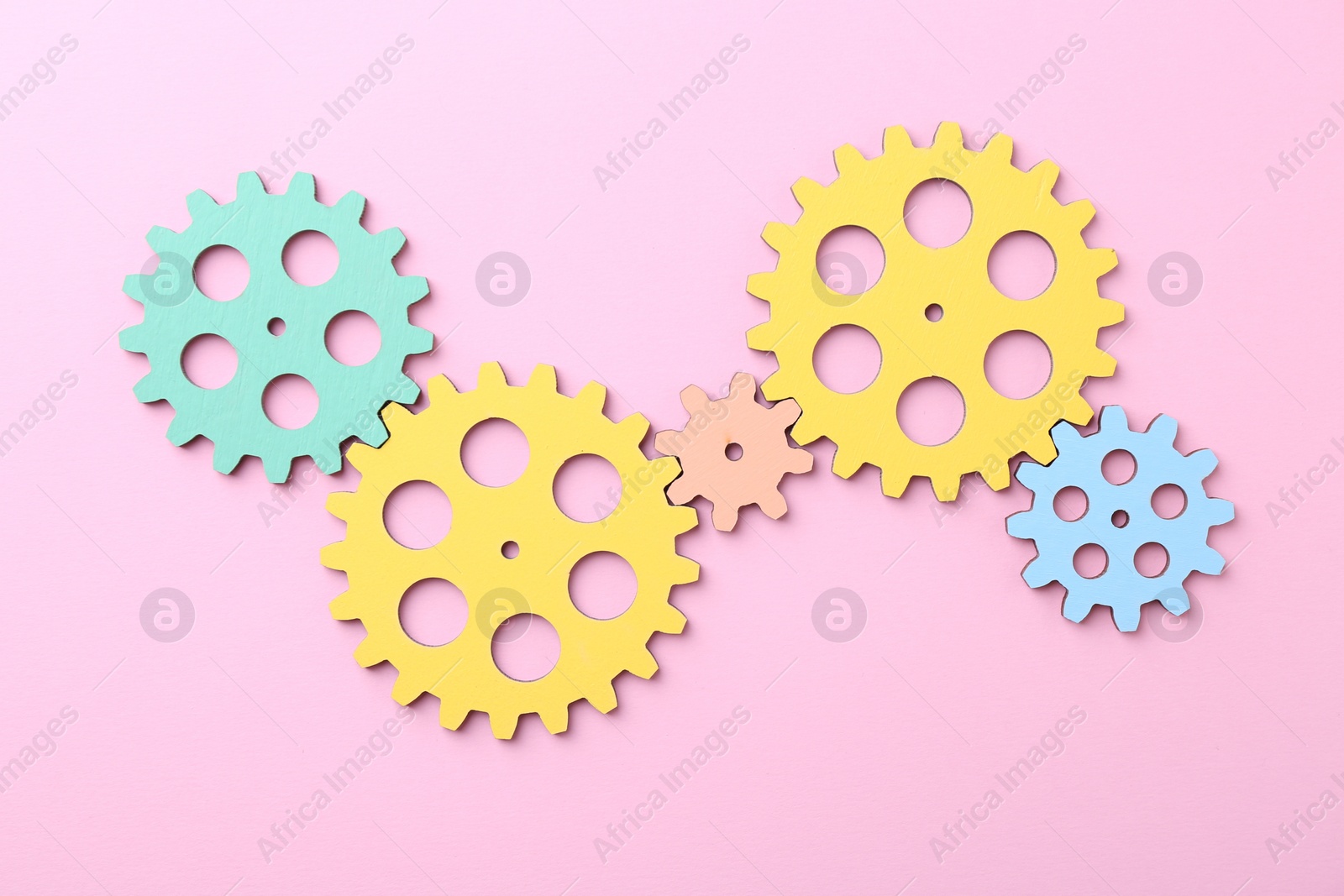 Photo of Business process organization and optimization. Scheme with colorful figures on pink background, top view