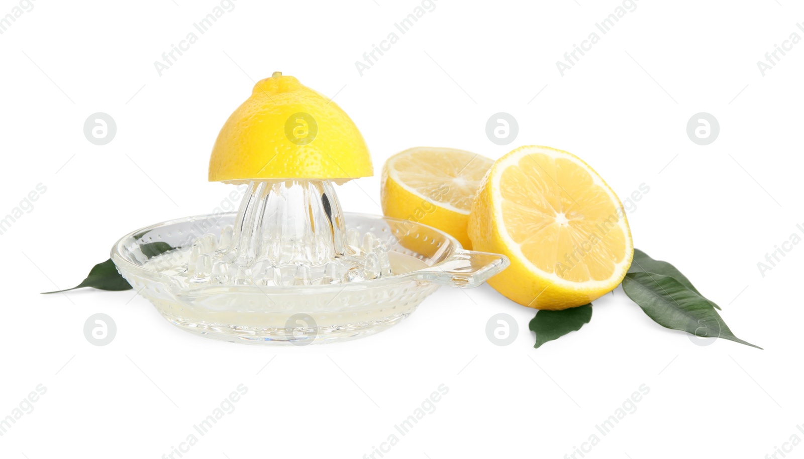 Photo of Glass squeezer and fresh lemons on white background
