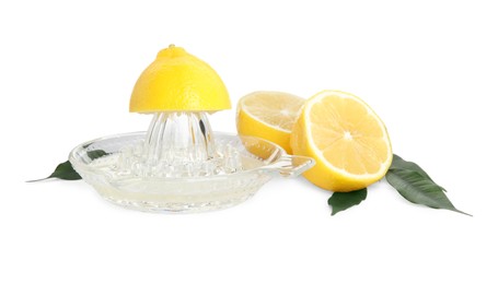 Photo of Glass squeezer and fresh lemons on white background