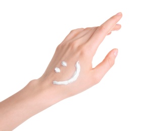 Young woman applying hand cream against on white background