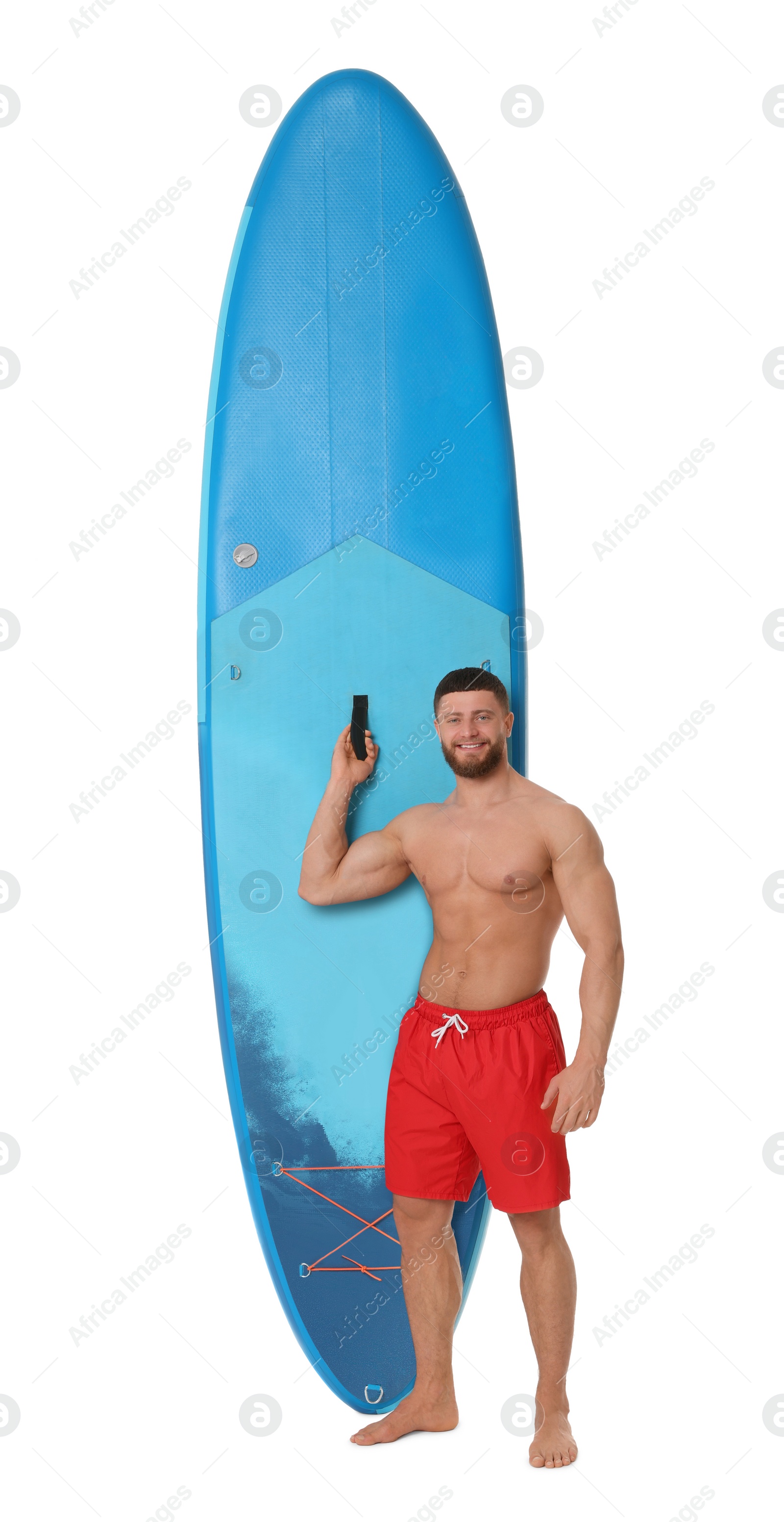 Photo of Handsome man with blue SUP board on white background