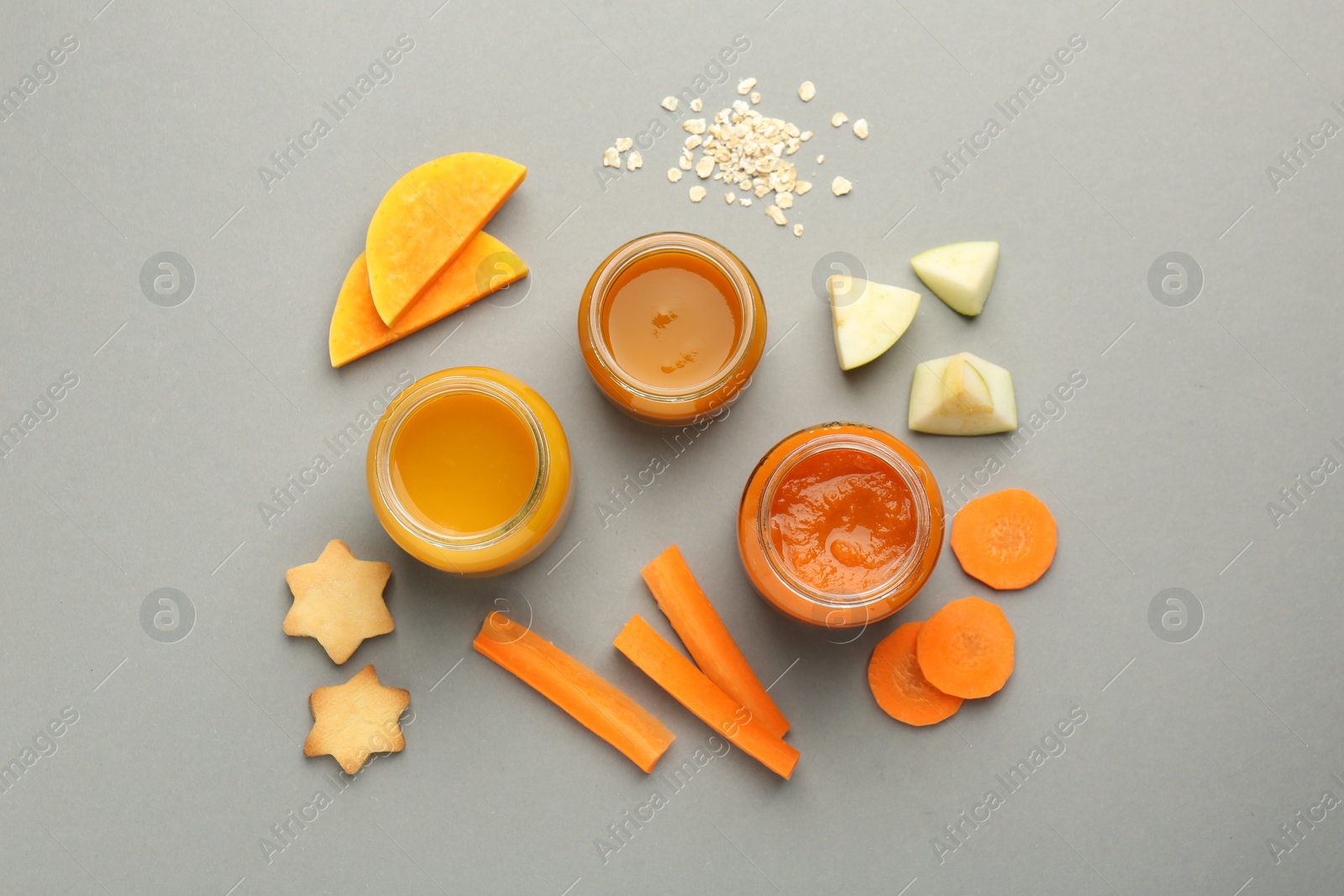 Photo of Flat lay composition with healthy baby food on grey background
