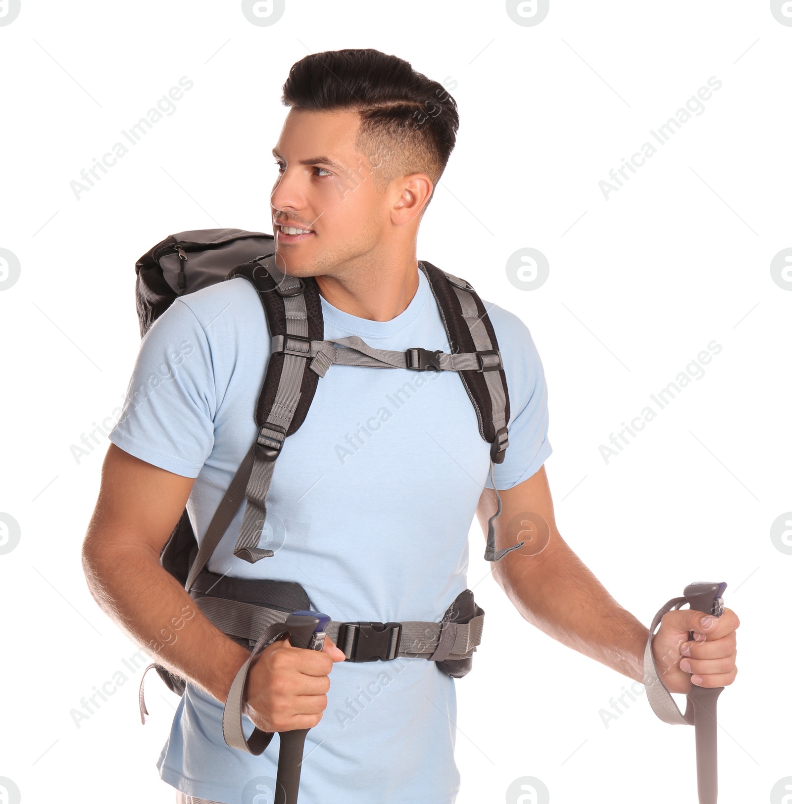 Photo of Male hiker with backpack and trekking poles on white background