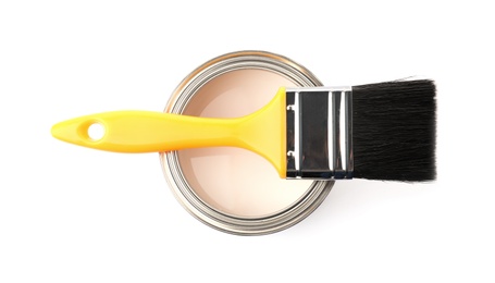 Paint can with brush on white background, top view