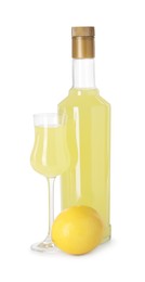 Tasty limoncello liqueur and lemon isolated on white