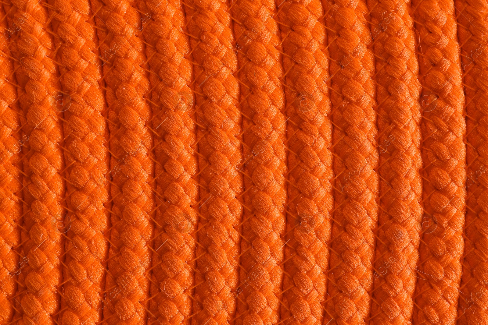 Photo of Texture of orange wicker mat as background, top view