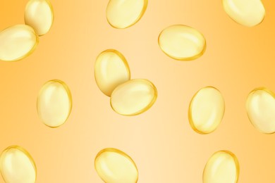 Image of Vitamin. Softgel capsules falling on orange gradient background