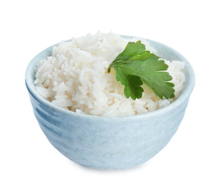 Photo of Bowl with cooked rice and parsley isolated on white