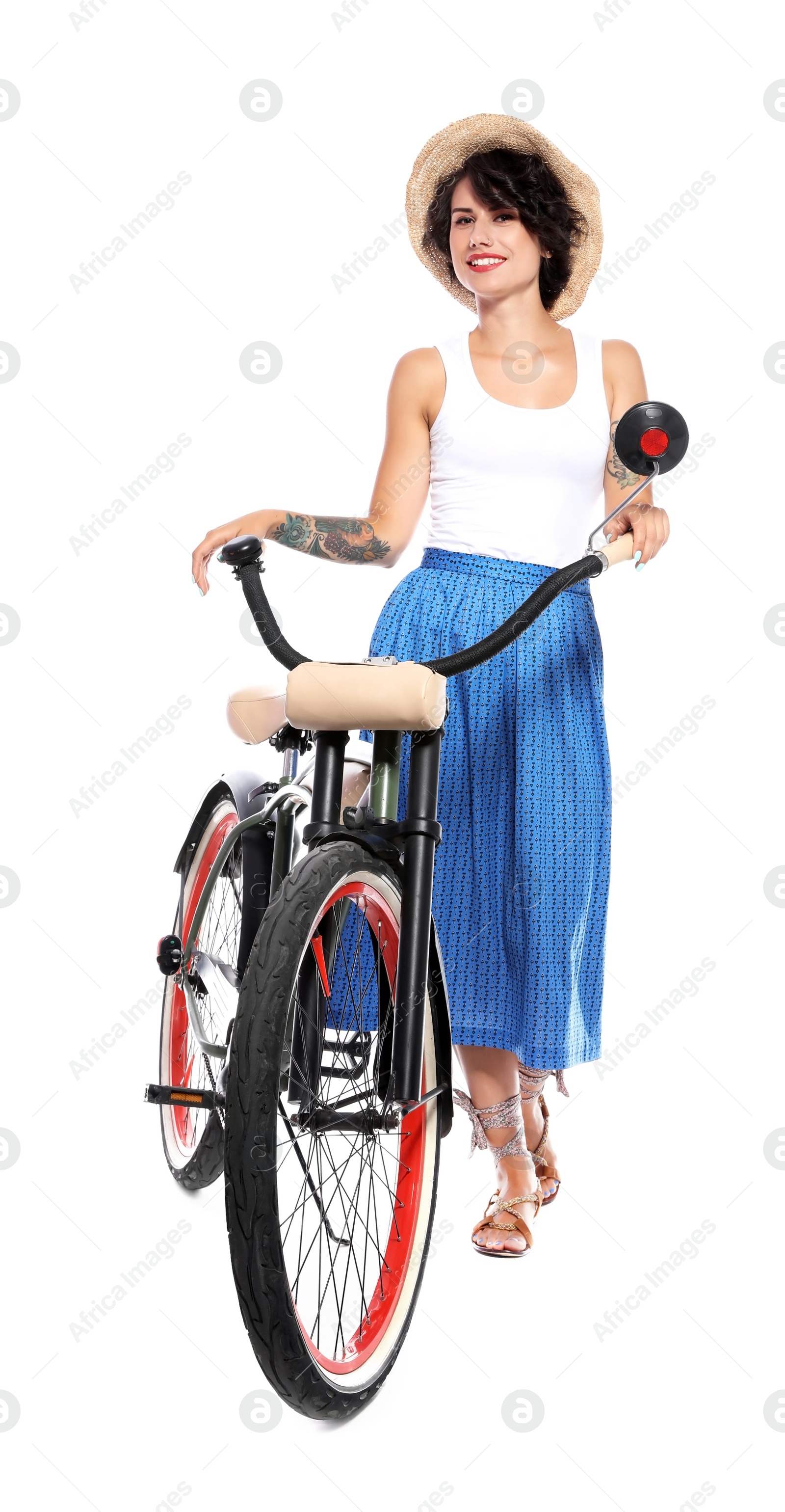 Photo of Portrait of beautiful young woman with bicycle on white background